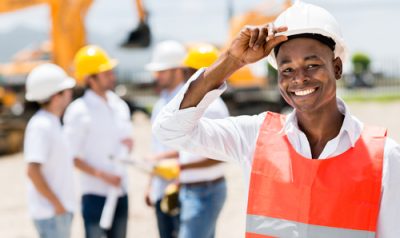 Happy,Male,Architect,At,A,Building,Site,Wearing,A,Helmet
